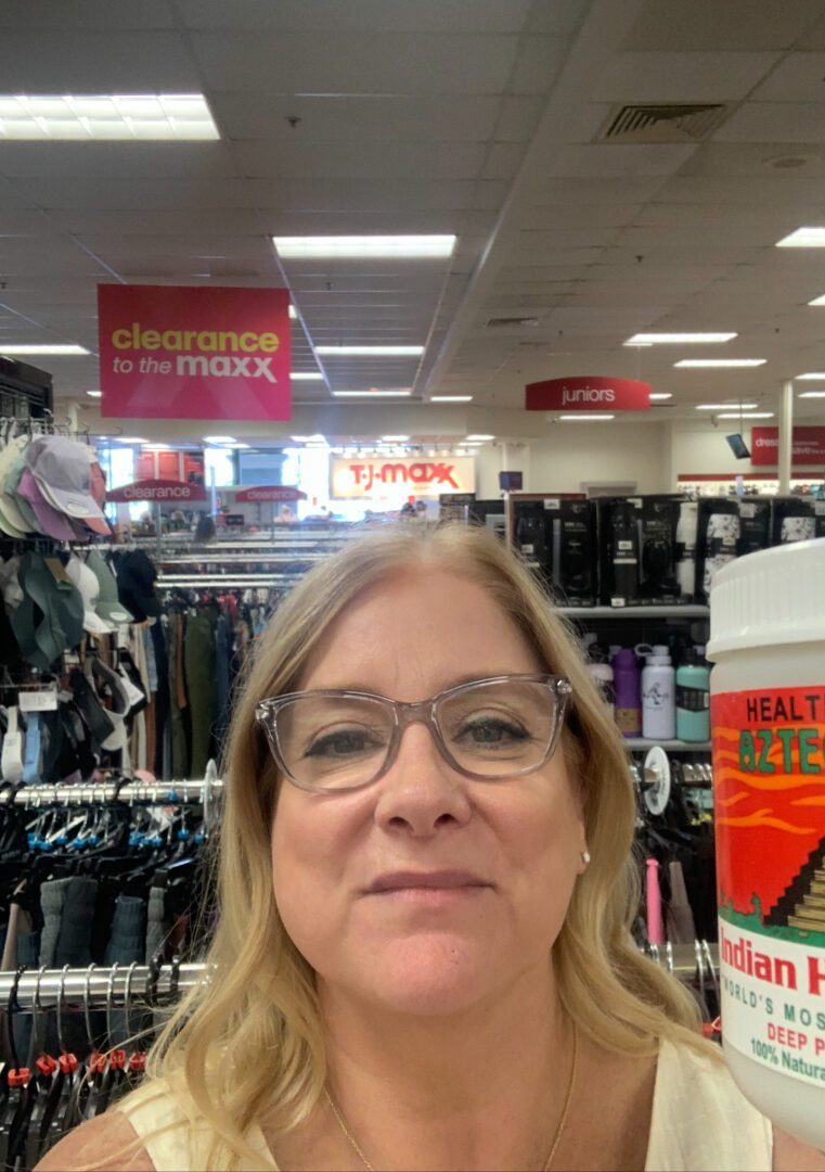 A woman smiling | Aztec Secret Health & Beauty LTD